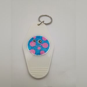 Motel Keychain With Blue And Pink Planet Design